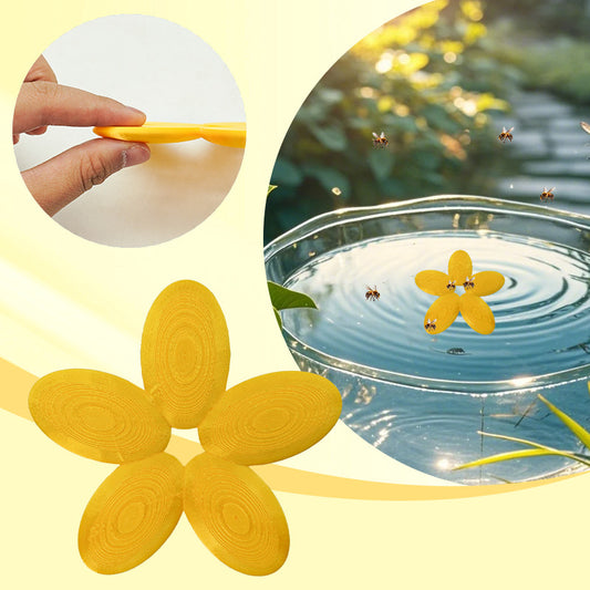 Yellow flower-shaped bee drinking water platform floating in birdbath with bees landing on it
