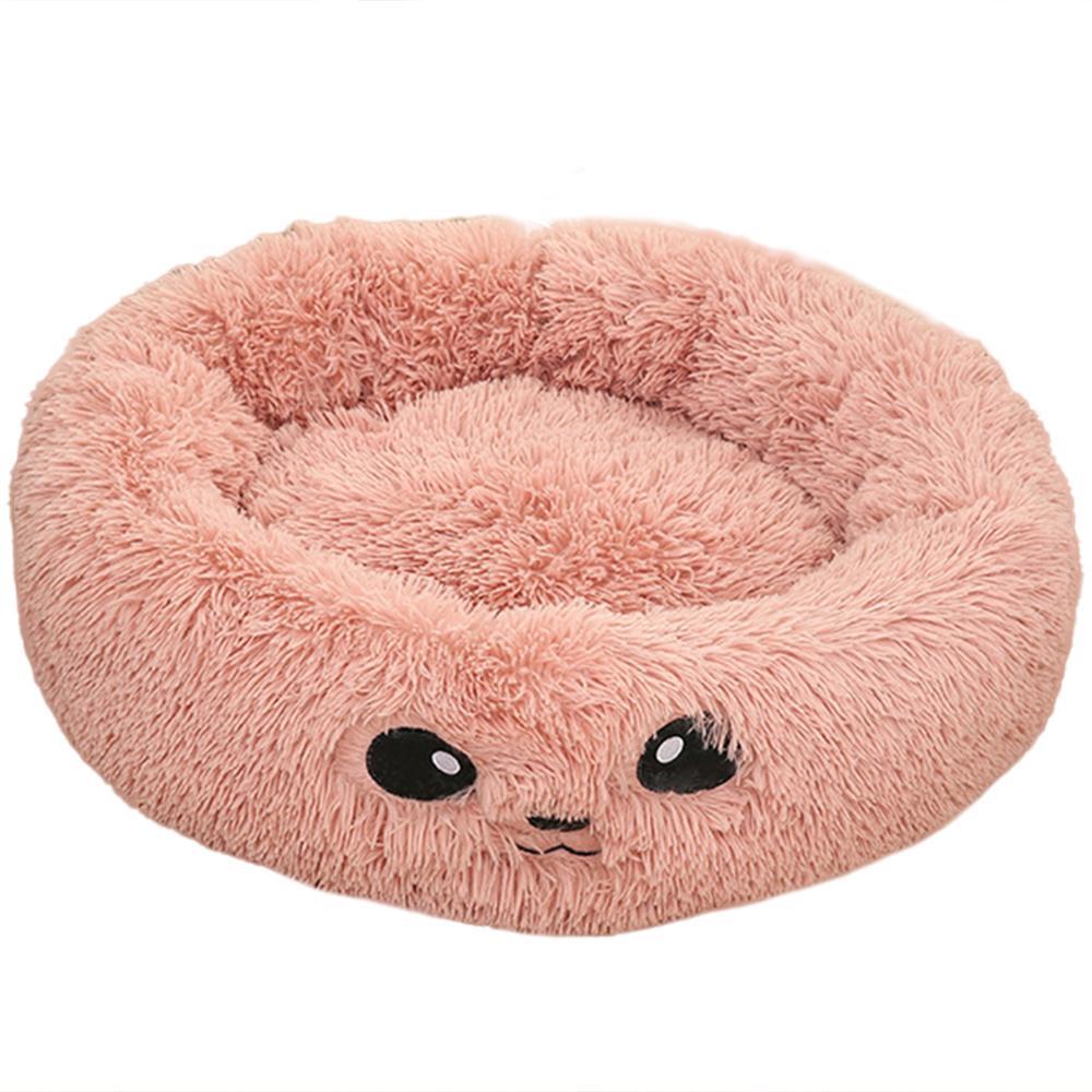 A coy Pink Cat Bed with eyes on it 