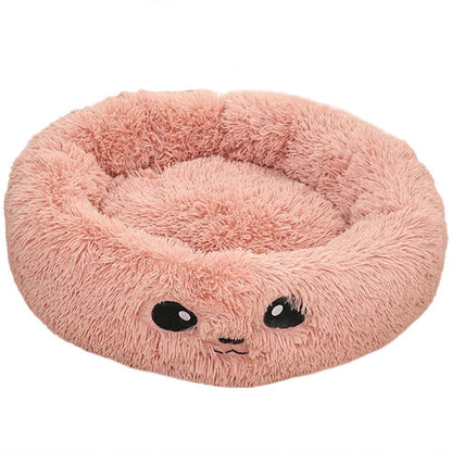 A coy Pink Cat Bed with eyes on it 