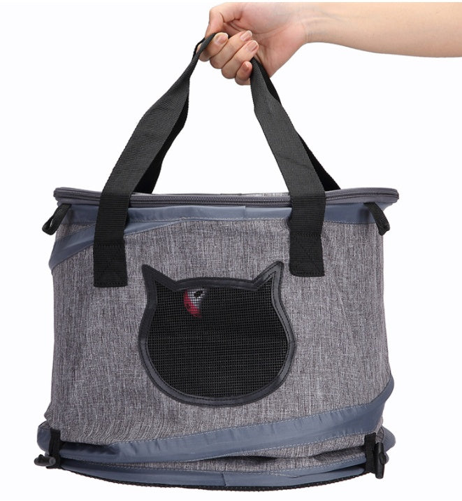 Cat Carrier showing the carrier folded and easy to carry handles. 