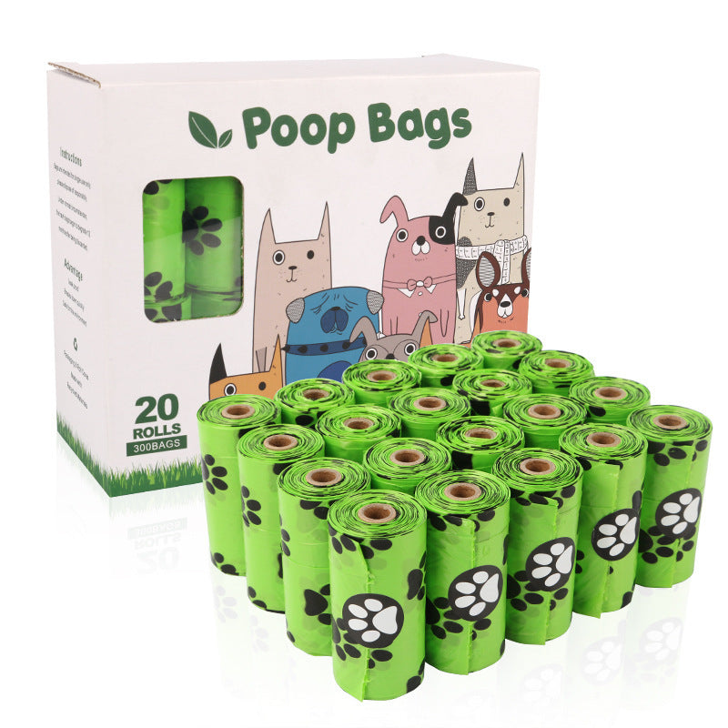 A hand holds a green bag with paw prints, emphasizing durability and leak-proof design for dog poop bags. 