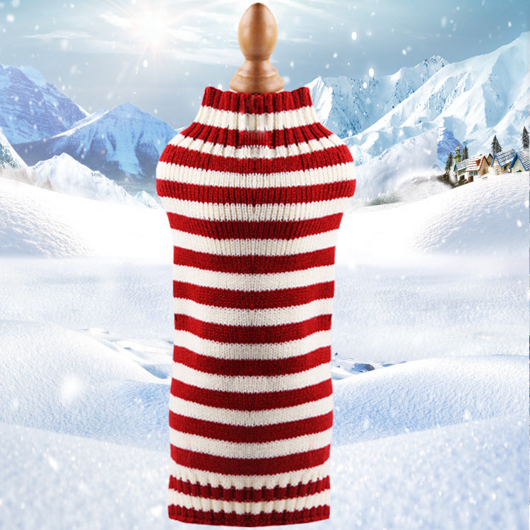 Cozy red and white striped Dog Sweater against a snowy mountain backdrop. 