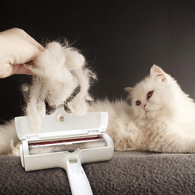 Hand holding a white Pet Lint Roller over a dark carpet, removing pet hair.