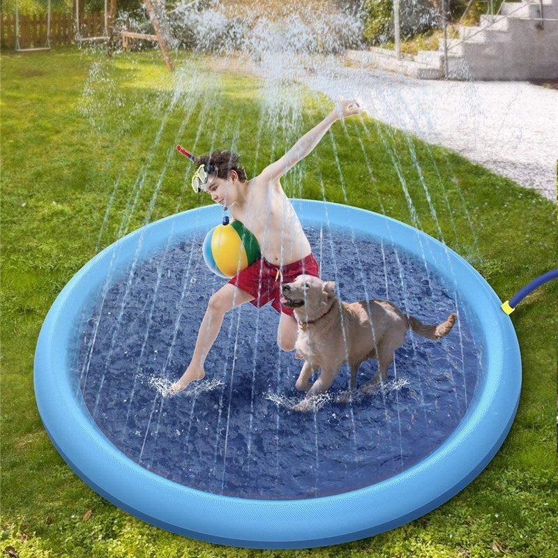 Splash Pad for Dogs, a young boy and a dog enjoy the cooling water in the slpash pad 