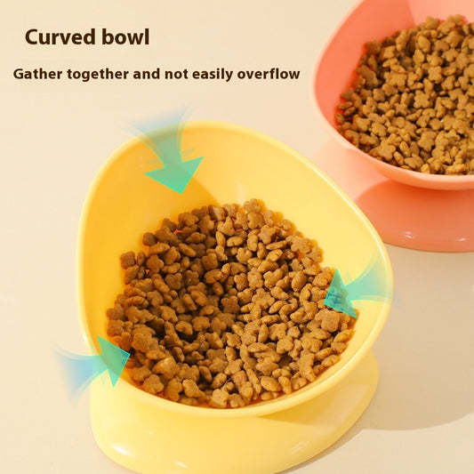 Yellow and pink curved anti-spill cat bowls filled with kibble, showing food gathering design