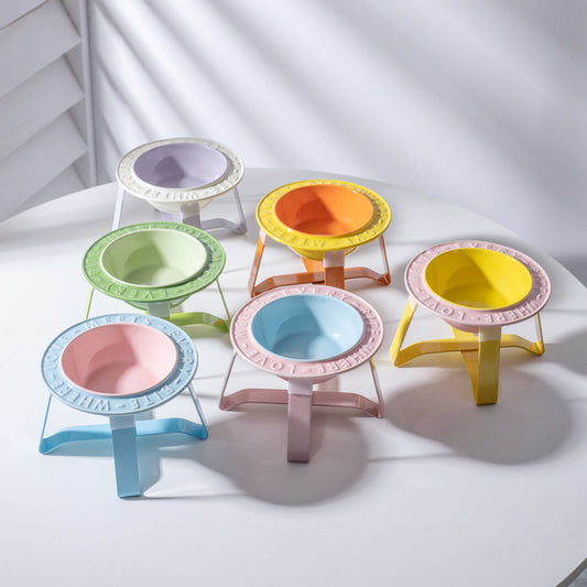 Set of six elevated ceramic cat bowls with raised tripod stands in lavender, orange, green, yellow, pink and blue for anti-tumble feeding